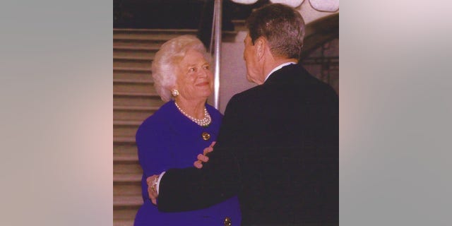 First Lady Barbara Bush with Ronald Reagan outside the White House on the day the former president was awarded the Medal of Freedom, January 13, 1993.