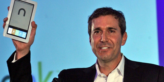 In this Oct. 20, 2009 file photo, William Lynch, then president of Barnes & Noble.com, unveils the "nook" electronic-book reader during a news conference in New York.