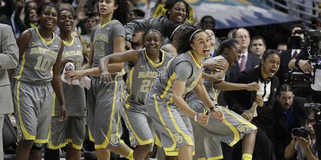 April 3, 2012: The Baylor team explodes off the bench at the end of the second half in the NCAA Women's Final Four college basketball championship game against Notre Dame, in Denver.