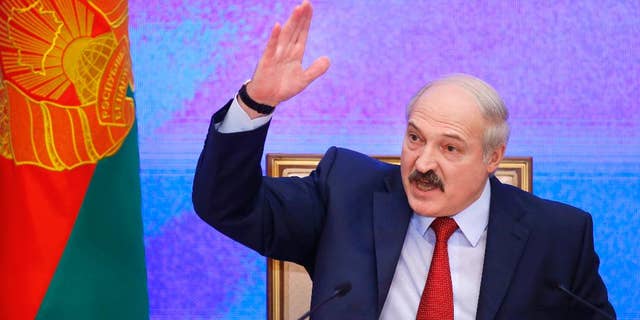 FILE - In this Thursday, Jan. 29, 2015 file photo, Belarusian President Alexander Lukashenko speaks during a news conference in Minsk, Belarus. Lukashenko said Tuesday that Belarus has no intention to host a Russian military base that Moscow wants to set up in the ex-Soviet nation. (AP Photo/Sergei Grits, file)