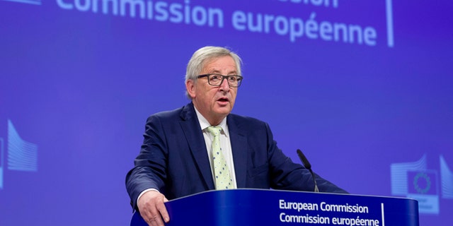 European Commission President Jean-Claude Juncker prepares to address a media conference at EU headquarters in Brussels on Friday, June 24, 2016. Top European Union officials were hunkering down in Brussels Friday to try to work out what to do next after the shock decision by British voters to leave the 28-nation bloc. (AP Photo/Thierry Monasse)
