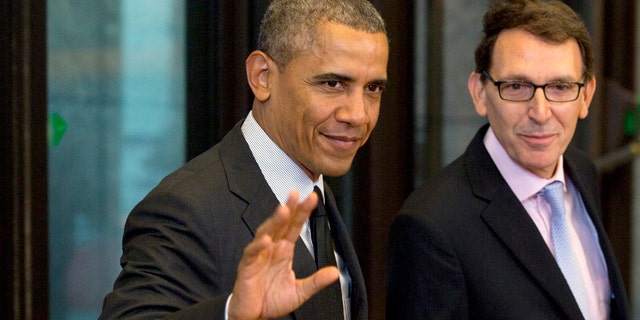 June 5, 2014: U.S. President Barack Obama, left, waves as he arrives for a G7 summit at the EU Council building in Brussels. The leaders of the G-7 group of major economies center their effort during the concluding day of their summit on spurring growth and jobs in an attempt to reinforce a rebound from the global financial crisis. (AP Photo/Virginia Mayo)