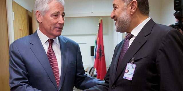 June 4, 2014: U.S. Defense Secretary Chuck Hagel, left, shakes hands with Afghanistan's Defense Minister Bismillah Khan Mohammadi, right, ahead of their North Atlantic Council (NAT) meeting, in Brussels. (AP)
