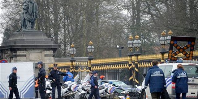 March 13: Police stand at the scene of an accident in front of the Royal Palace in Laeken, Belgium.