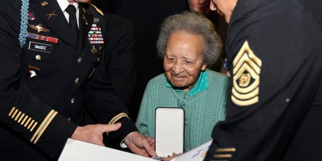 Dec. 12: Belgian nurse Augusta Chiwy, who saved hundreds of wounded GIs during the WWII Battle of the Bulge, receives an award for valor from the U.S. Army, in Brussels.