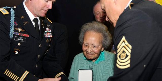 Dec. 12: Belgian nurse Augusta Chiwy, who saved hundreds of wounded GIs during the WWII Battle of the Bulge, receives an award for valor from the U.S. Army, in Brussels.