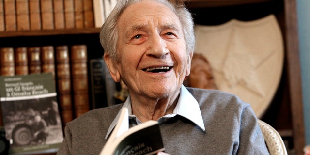 May 8, 2014: Bernard Dargols poses during an interview with the Associated Press at his home in La Garenne-Colombes, outside Paris, France. When he left Paris at age 18, the plan was to go to New York for a year and learn his fathers sewing machine trade. Six years later, Bernard Dargols found himself crossing the Channel in a U.S. Army uniform, sloshing ashore on Omaha Beach to a homeland that had persecuted his Jewish family.