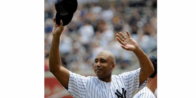 Former New York Yankees center fielder Bernie Williams reacts to applause during Old Timers' Day ceremonies on Sunday, June 26, 2011, at Yankee Stadium in New York.