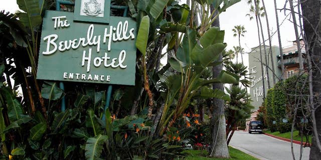 FILE - In this April 25, 2012 file photo, the entrance to the Beverly Hills Hotel is seen in Beverly Hills, Calif.  Hollywood is responding to harsh new laws in Brunei by boycotting the Beverly Hills Hotel. The Motion Picture &amp; Television Fund joined a growing list of organizations and individuals Monday, May 5, 2014, refusing to do business with hotels owned by the Sultan or government of Brunei to protest the country’s new penal code that calls for punishing adultery, abortions and same-sex relationships with flogging and stoning.  (AP Photo/Matt Sayles, File)