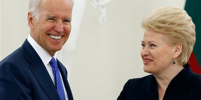 Vice President Joe Biden, left, and Lithuania's President Dalia Grybauskaite speak prior to their meeting at the Presidential Palace in Vilnius, Lithuania, Wednesday, March 19, 2014. Biden arrived in Vilnius for consultations with Grybauskaite and Latvia's President Andris Berzins, a few hours after Russian President Vladimir Putin approved a draft bill for the annexation of Crimea, one of a flurry of steps to formally take over the Black Sea peninsula. (AP Photo/Mindaugas Kulbis)