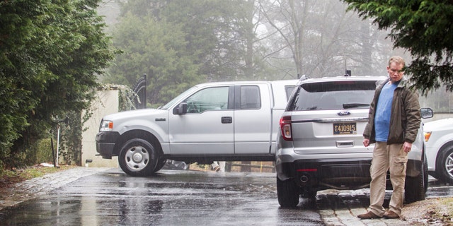 Jan. 18, 2015: A security official stands at the end of the driveway leading to Vice President Joe Biden's home in Greenville, Del. Multiple gunshots were fired from a vehicle near Biden's Delaware home Saturday night, the U.S. Secret Service said Sunday. (AP Photo/The News Journal, Kyle Grantham)