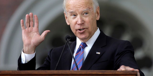 FILE - In this May 24, 2017, file photo, former Vice President Joe Biden delivers the annual Harvard College Class Day address on the campus of Harvard University, in Cambridge, Mass. Just days after launching a new political action committee, former Biden will join Republican officials and donors at a weekend retreat hosted by former GOP presidential nominee Mitt Romney. (AP Photo/Steven Senne, File)