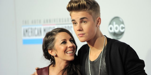 Nov. 18, 2012: In this file photo, Justin Bieber, right, and Pattie Mallette arrive at the 40th Anniversary American Music Awards, in Los Angeles.