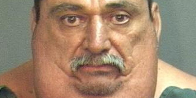 This photo provided by the Santa Ana Police Dept. shows 55-year-old Victor Joseph Espinoza.