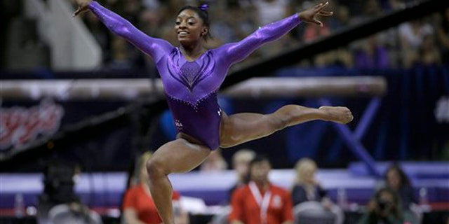 Simone Biles competes on the floor exercise during the women's U.S. Olympic gymnastics trials in San Jose, Calif., Friday, July 8, 2016. (AP Photo/Ben Margot)