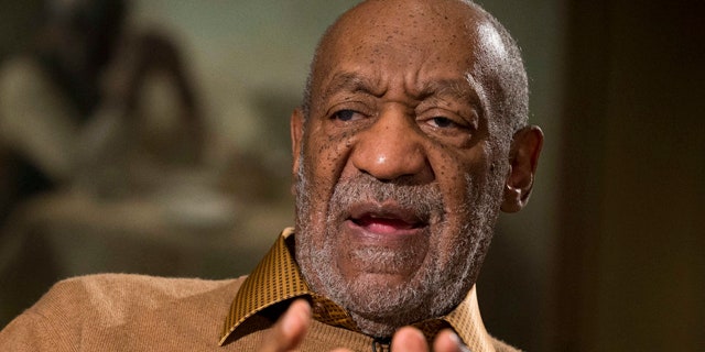 FILE - In this Nov. 6, 2014 file photo, entertainer Bill Cosby gestures during an interview about the upcoming exhibit, 'Conversations: African and African-American Artworks in Dialogue,' at the Smithsonian's National Museum of African Art, in Washington. (AP Photo/Evan Vucci, File)