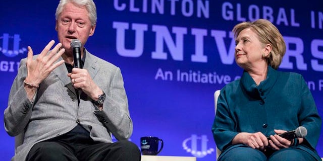Former President Bill Clinton and former Secretary of State Hillary Clinton at the 2014 Meeting of Clinton Global Initiative University at Arizona State University in Tempe March 22, 2014.