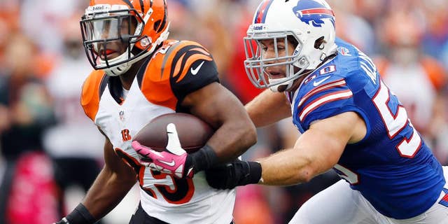 FILE - In this Oct. 13, 2013, file photo, Cincinnati Bengals' Giovani Bernard (25) runs downfield as Buffalo Bills' Kiko Alonso closes in during the second half of an NFL football game in Orchard Park, N.Y. General manager Doug Whaley announced that Alonso had been hurt with what the team fears to be a serious knee injury while working out in Oregon released in a statement by the team Tuesday, July 1, 2014. (AP Photo/Gary Wiepert File)