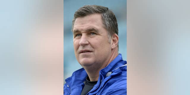 In this Dec. 15, 2013, photo, Buffalo Bills coach Doug Marrone watches players warm up for NFL football game between the Jacksonville Jaguars and the Bills in Jacksonville, Fla. Marrone said Tuesday night, April 22, 2014, he had a cancerous mole removed, and added it will not have any effect on him doing his job. Marrone made the announcement in a statement released through the team. (AP Photo/Phelan M. Ebenhack)