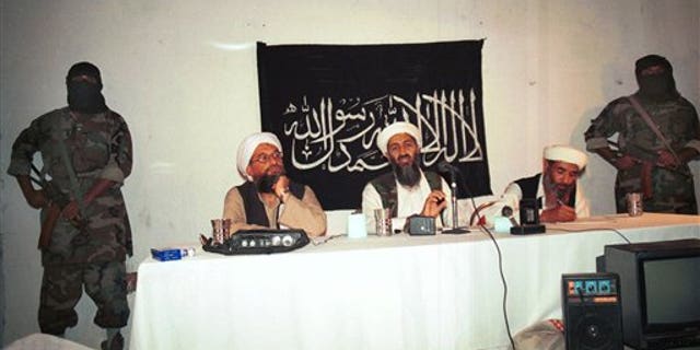 1998: Osama bin Laden flanked by his aides and armed bodyguards in a meeting at an undisclosed location in Afghanistan.