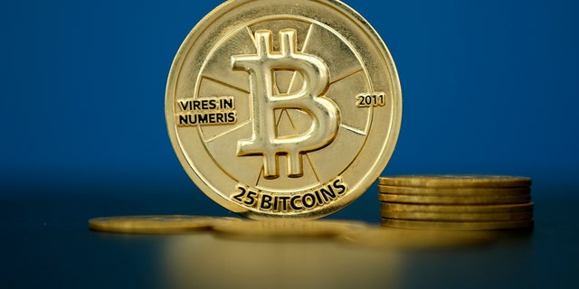Bitcoin (virtual currency) coins are seen in an illustration picture taken at La Maison du Bitcoin in Paris, France, May 27, 2015.