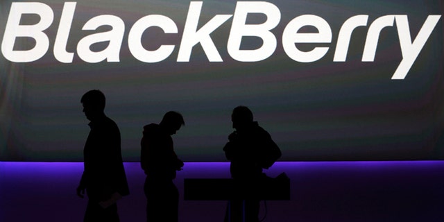 FILE - In this Wednesday, Jan. 30, 2013, file photo, blackBerry's employees prepare the launch event for the company's new smartphones in London. Fairfax Financial Holdings has offered to buy BlackBerry in a deal that values the Canadian smartphone company at about US$4.7 billion, on Monday, Sept. 23, 2013. AP Photo/Lefteris Pitarakis, File)