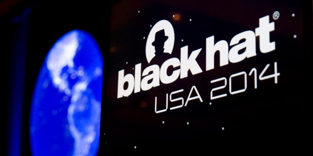 The Black Hat logo is shown on a podium during the Black Hat USA 2014 hacker conference at the Mandalay Bay Convention Center in Las Vegas, Nevada August 6, 2014. REUTERS/Steve Marcus (UNITED STATES - Tags: SCIENCE TECHNOLOGY) - RTR41H30