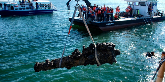 File photo - A one-ton cannon which was recovered from the Queen Anne's Revenge shipwreck site, is pulled from the water near Beaufort, North Carolina, Oct. 26, 2011.