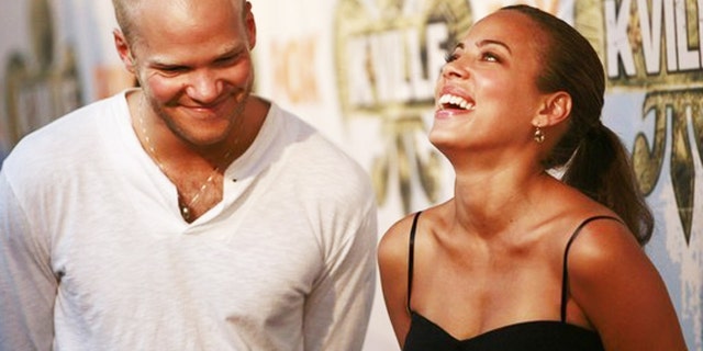 Cast members Blake Shields (L) and Tawny Cypress laugh before a party celebrating the television series "K-Ville" in New Orleans, Lousiana August 19, 2007.