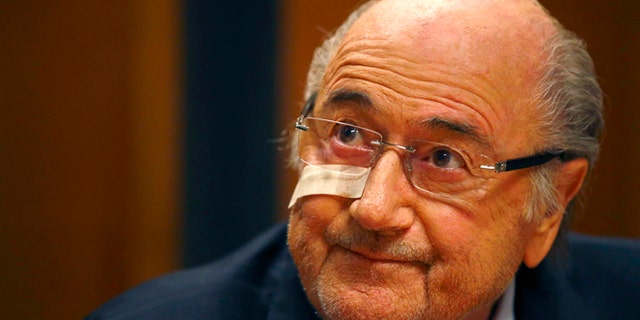 Suspended FIFA President Sepp Blatter attends a news conference in Zurich, Switzerland,  Monday, Dec. 21, 2015 after he has been banned for 8 years from all football related activities. (AP Photo/Matthias Schrader)