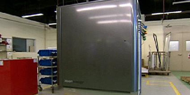 A screenshot from 60 Minutes showing the Bloom Box, a fridge-sized fuel cell designed to make electricity through chemistry.