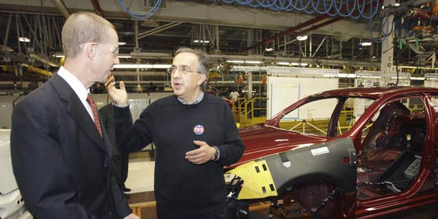 Chrysler Group CEO Sergio Marchionne, right, and Ron Bloom, assistant to President Obama for Manufacturing Policy walk on the assembly line at the Sterling Heights Assembly Plant in Sterling Heights, Mich., Tuesday, May 24, 2011. Marchionne acknowledged and expressed gratitude for the financial support from the U.S. and Canadian governments. (AP Photo/Carlos Osorio)