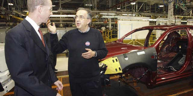Chrysler Group CEO Sergio Marchionne, right, and Ron Bloom, assistant to President Obama for Manufacturing Policy walk on the assembly line at the Sterling Heights Assembly Plant in Sterling Heights, Mich., Tuesday, May 24, 2011. Marchionne acknowledged and expressed gratitude for the financial support from the U.S. and Canadian governments. (AP Photo/Carlos Osorio)