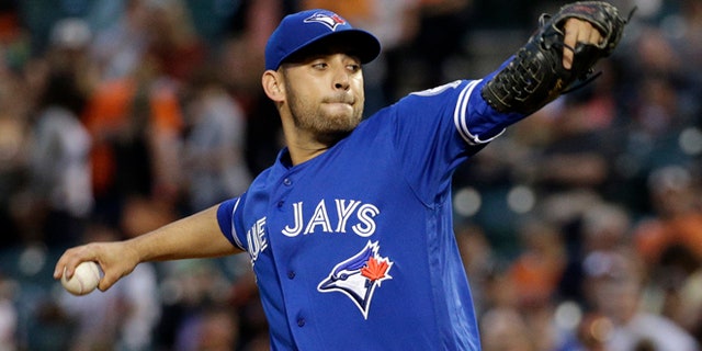 FILE- In this April 21, 2016, file photo, Toronto Blue Jays starting pitcher Marco Estrada throws to the Baltimore Orioles during the first inning of a baseball game in Baltimore. Estrada has gone on the disabled list because of a sore lower back and will not play in the All-Star Game. "My worst nightmare came true, unfortunately," Estrada said Wednesday, July 6. "In the long run, this is the right thing to do." (AP Photo/Patrick Semansky, File)