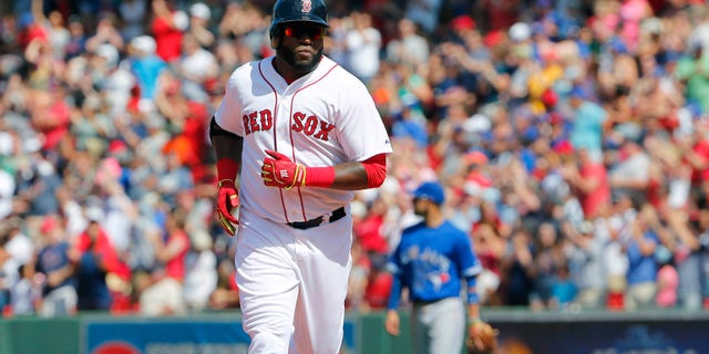 Boston Red Sox designated hitter David Ortiz rounds the bases after hitting a solo home run against the Toronto Blue Jays during the sixth inning of a baseball game at Fenway Park in Boston Saturday, June 13, 2015. (AP Photo/Winslow Townson)
