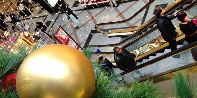 Nov. 26, 2013: Shoppers move through a mall in Cambridge, Mass.