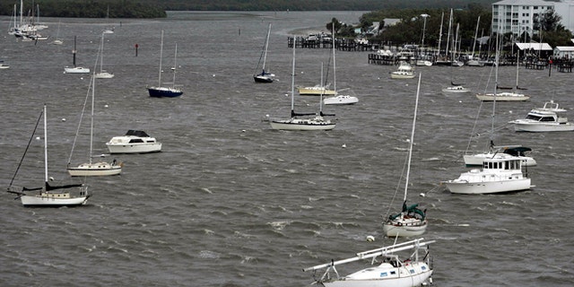 Anchored pleasure boats rock in the rolling sea October 24, 2005 in Ft. Myers, Florida. (Photo by Chris Hondros/Getty Images)