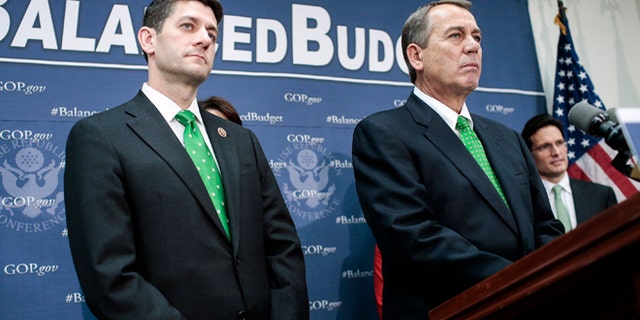 WASHINGTON, DC - MARCH 19: Rep. Paul Ryan (R-WI) (L) and House Speaker John Boehner (R-OH) listen to a question as House Republican leaders address the media after a party conference on March 19, 2013 in Washington, DC. GOP leaders asked that the president work with them to create a balanced budget plan, citing President Clinton's efforts to work with House Republicans on a budget in the 1990s. (Photo by T.J. Kirkpatrick/Getty Images)