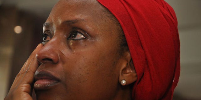 July 8: An unidentified mother of a child that was abducted by Nigerian extremists reacts during an event in the memory of the girls.