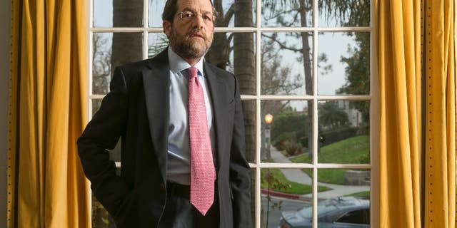 FILE - In this Dec. 15, 2014 file photo, U.S. businessman businessman Jacob Ostreicher poses for a photo in Los Angeles. A Bolivian judge sentenced to three years in prison on Thursday, Jan. 15, 2015 the No. 2 figure in the extortion ring that victimized Ostreicher and was exposed by actor Sean Penn. Ostreicher went to Bolivia to salvage a rice-farming venture only to be arrested in June 2011 and held 18 months without charge in a money-laundering investigation. The extortion ring drained the assets of the $25 million rice venture. (AP Photo/Damian Dovarganes, File)