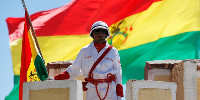UYUNI, BOLIVIA - JANUARY 11: A soldier at Denodado y Aguerrido RI-4 LOA Military Base stands at attention during Day 7 of the 2014 Dakar Rally on January 11, 2014 in Uyuni, Bolivia. (Photo by Dean Mouhtaropoulos/Getty Images)