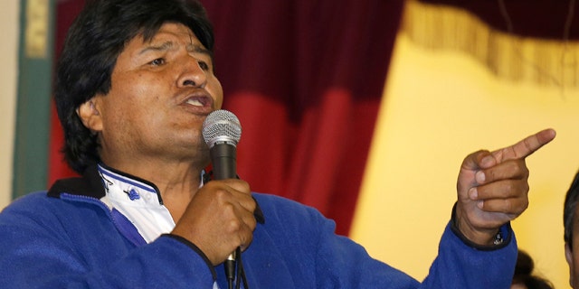 October 12, 2014: Bolivia's President Evo Morales speaks to supporters from the balcony of the presidential palace in La Paz. (AP Photo/Martin Mejia)