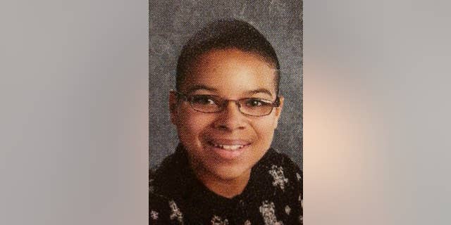 This 2010 yearbook photo provided by Topeka Public Schools from a Topeka West High School shows John Booker. Booker, accused of planning a suicide attack at Fort Riley, was arrested Friday, April 10, 2015, while trying to arm what he thought was a bomb near the Kansas military base as part of a plot to support the Islamic State group, federal prosecutors said. (AP Photo/Topeka Public Schools)