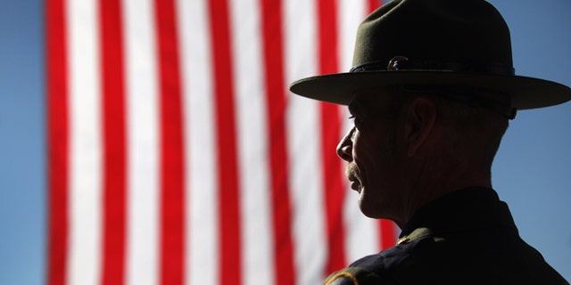 TUCSON, AZ - JANUARY 21: U.S. Border Patrol agent Michael Wagenen attends a memorial service for slain comrade Brian Terry on January 21, 2011 in Tucson, Arizona. Agent Terry was killed during a December14 shootout with suspected bandits near the U.S.-Mexico Border. Thousands of Border Patrol agents and fellow law enforcement officers from across Arizona turned out for the memorial service held at Kino baseball stadium in Tucson. With U.S. agents tracking drug smugglers and illegal immigrants all along the border, the region has become one of the most militarized areas of the United States. (Photo by John Moore/Getty Images)