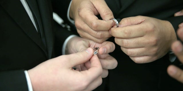 FORT LAUDERDALE, FL - JANUARY 06: A couple exchange rings as they are wed during a wedding ceremony at the Broward County Courthouse on January 6, 2015 in Fort Lauderdale, Florida. Gay marriage is now legal statewide after the courts ruled that the ban on gay marriage is unconstitutional and the Supreme Court declined to intervene. (Photo by Joe Raedle/Getty Images)