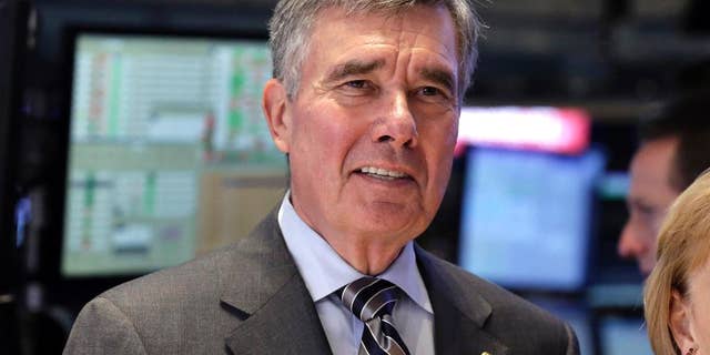 FILE - U.S. Customs and Border Protection Commissioner R. Gil Kerlikowske poses for photos after ringing the New York Stock Exchange closing bell, Tuesday, Aug. 5, 2014 file photo. Kerlikowske scheduled a news conference Thursday Sept. 18, 2014 in Washington to discuss what his office said were “developments toward CBP’s commitment to increase transparency and accountability.” (AP Photo/Richard Drew, File)