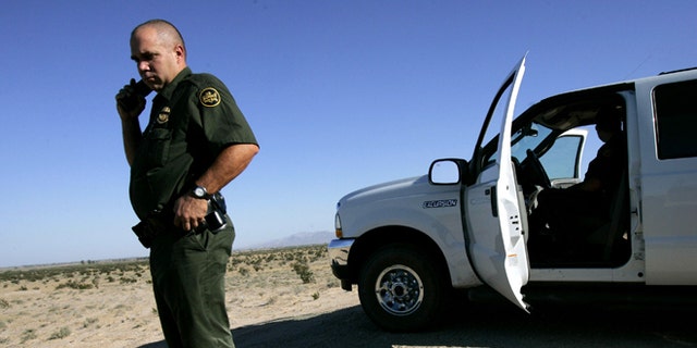 EL CENTRO, CA - AUGUST 29:  Border Patrol agent, Scott Plesuk, patrols the border in the desert August 29, 2005 near El Centro, California. The governors of New Mexico and Arizona have declared a state of emergency along the border due to drug trafficking, illegal immigration and threat of terrorists coming through Mexico.  (Photo by Sandy Huffaker/Getty Images)