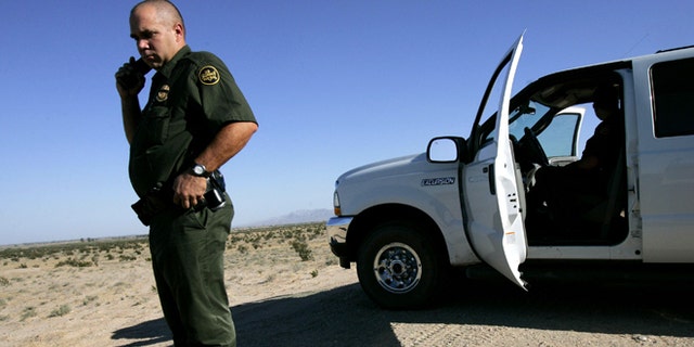 EL CENTRO, CA - AUGUST 29: Border Patrol agent, Scott Plesuk, patrols the border in the desert August 29, 2005 near El Centro, California. The governors of New Mexico and Arizona have declared a state of emergency along the border due to drug trafficking, illegal immigration and threat of terrorists coming through Mexico. (Photo by Sandy Huffaker/Getty Images)