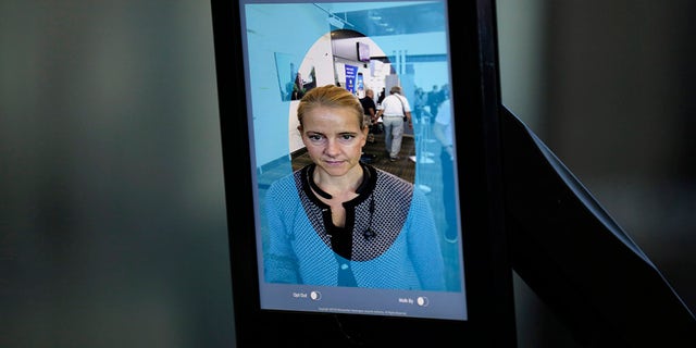 The system takes a picture of the person and runs it through a database to compare with visa and passport pictures of people scheduled to fly that day.