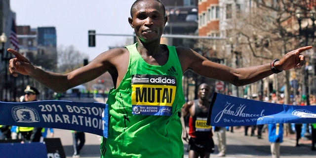 April 18, 2011: Winner Geoffrey Mutai of Kenya crosses the finish line of the 115th Boston Marathon.